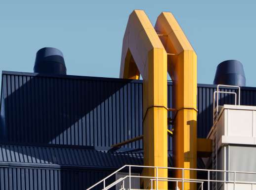 Air ducts leading from roof on new, modern-style building.