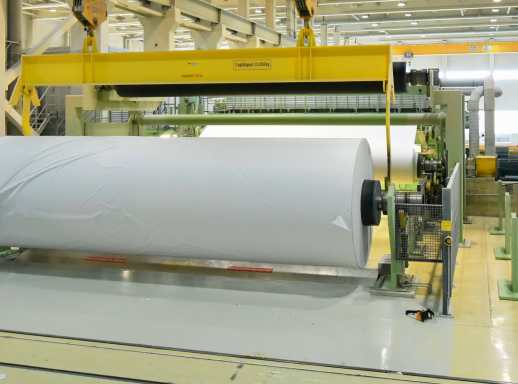 Machines for rolling paper in a paper mill.