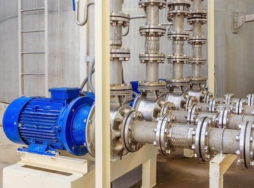 Pump connectors on pumps in large facility.