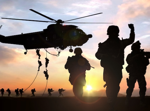 silhouette of military operation at sunset