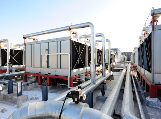 Sets of cooling towers in data center building.